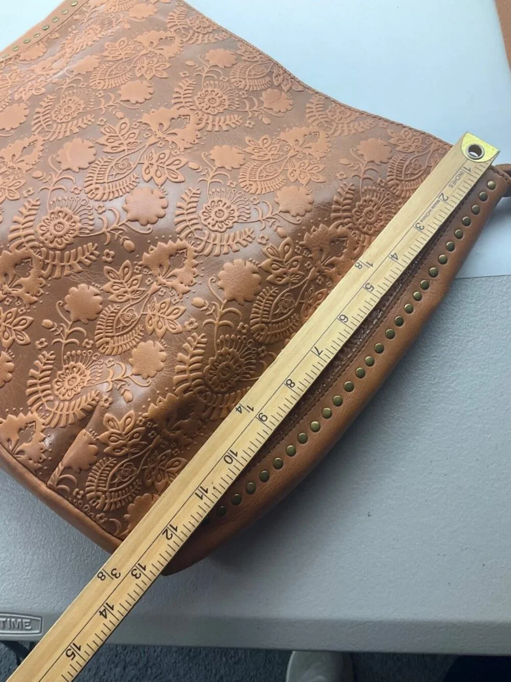 The Sak Leather Hobo Indio Floral Tooled Slouchy Tan Shoulder Bag Tassel Charm